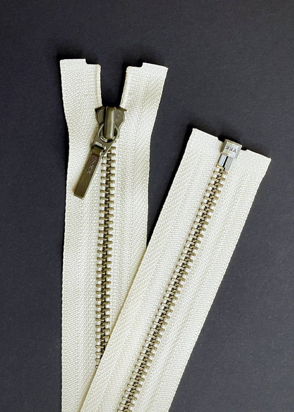 YKK, Open Ended Zip Drop Pull. Antique Brass. Cream. 60cm